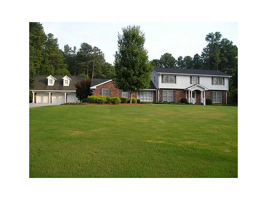 Exterior Front. Beautifully landscaped yard with i