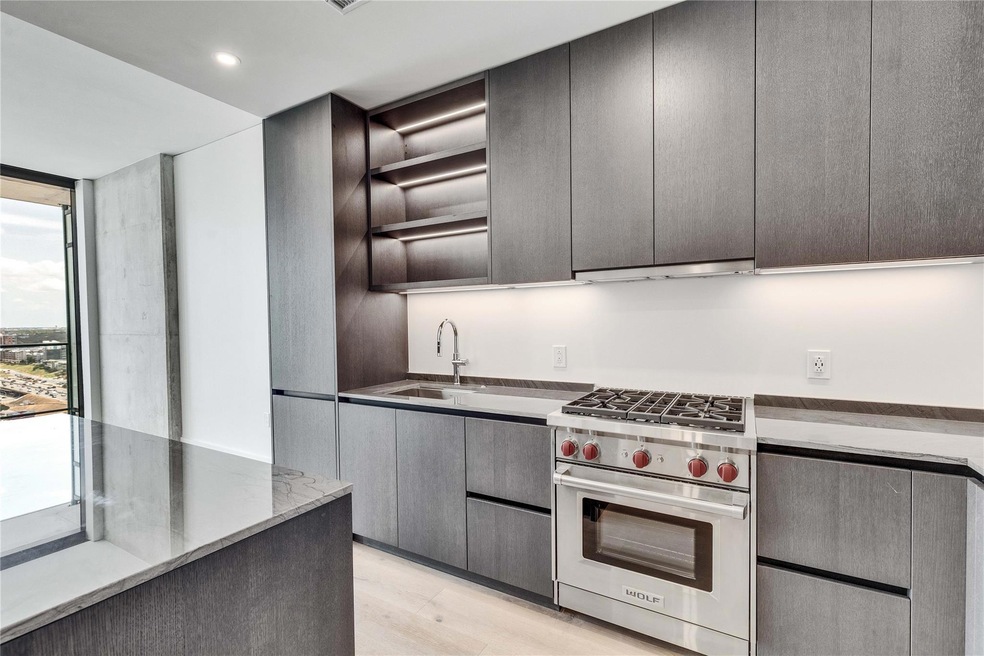 Kitchen with designer range, open shelves, under 
