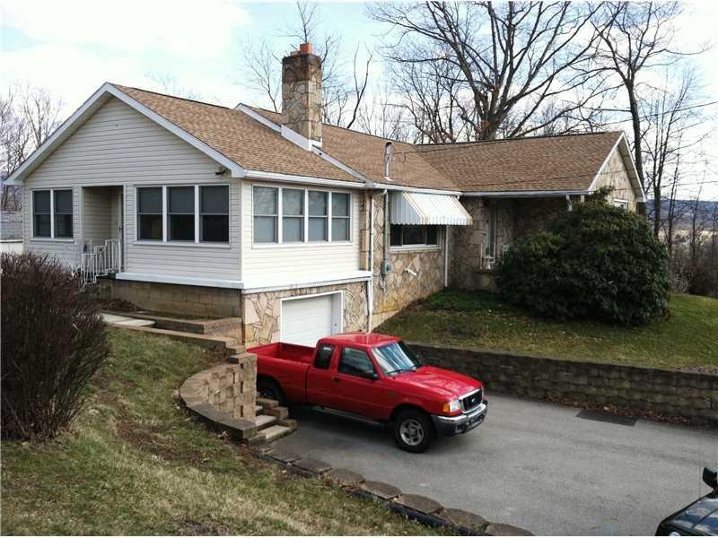 Exterior Front. Lovely stone ranch with added sun 