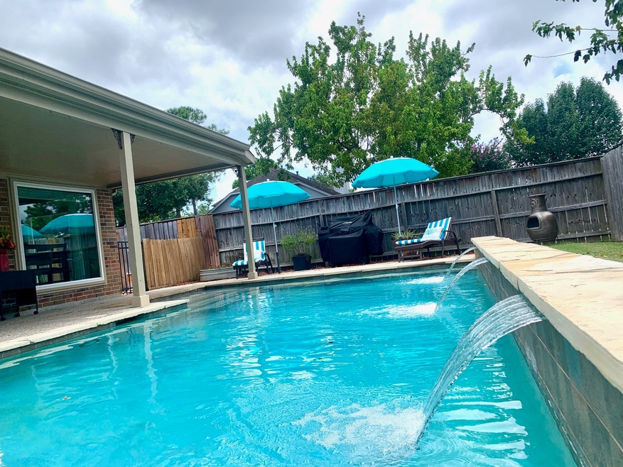 Enjoy your Refreshing Pool/ Spa and Covered Porch Patio while entertaining Friends and Family during the warm Summer months