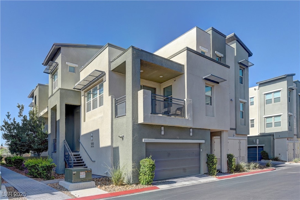 View of building exterior featuring a garage