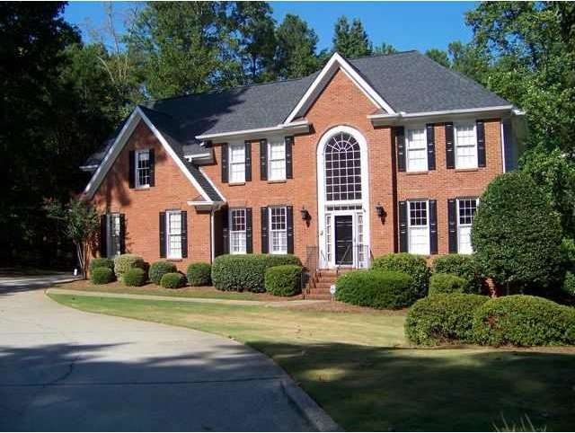 Exterior Front. 3 sides Brick and New Roof.