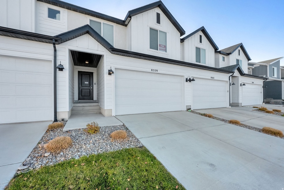 Modern farmhouse style home with driveway, board and batten siding, a residential view, and an attached garage