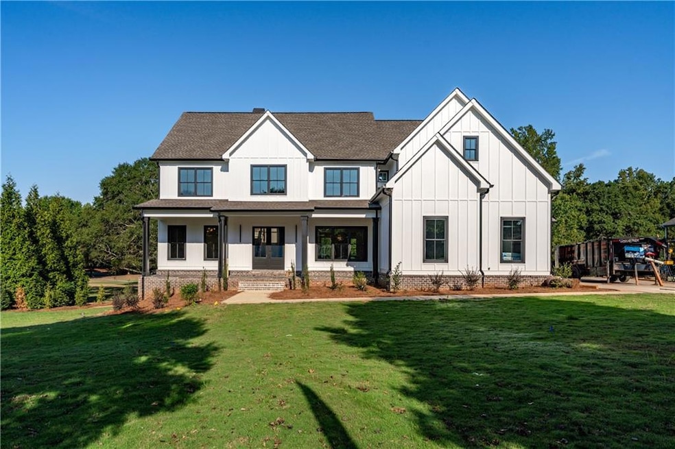 View of front of property with covered porch and a