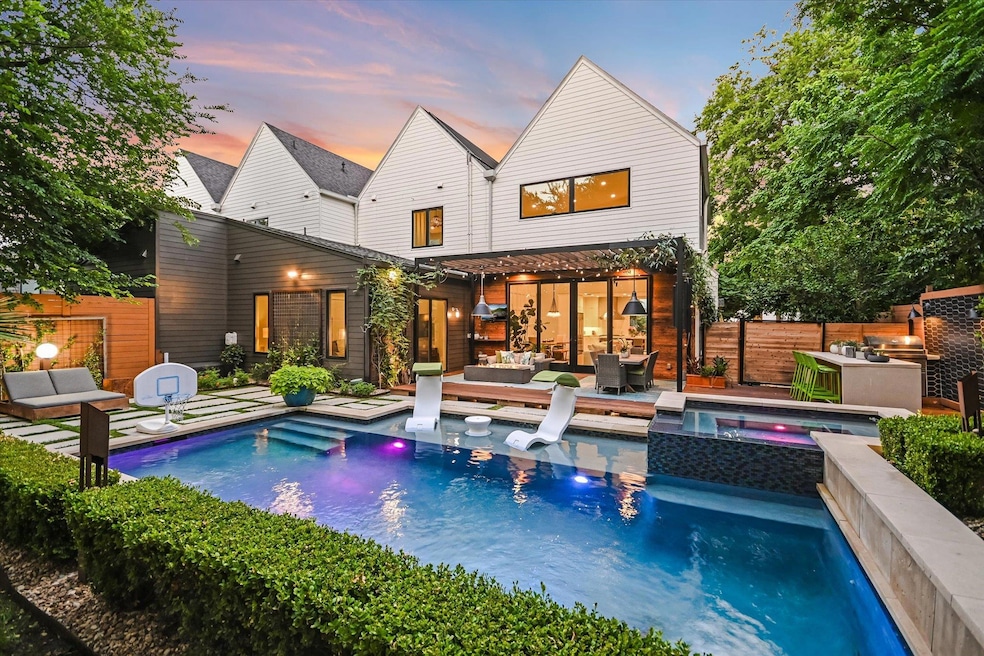Back of house at dusk with outdoor lounge area, f