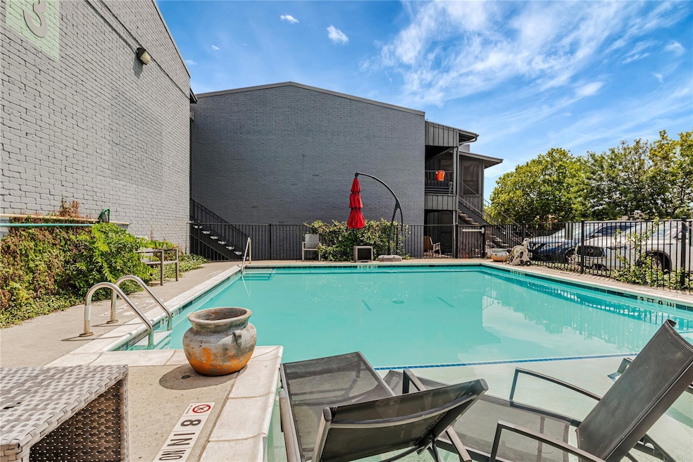 Community pool with stairway and a sink
