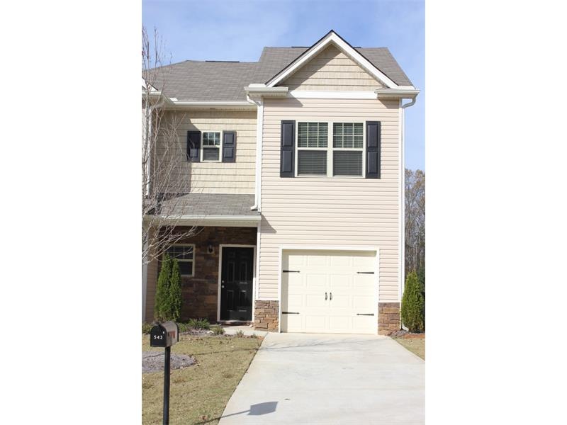 Meticulously maintained end unit townhome with upg