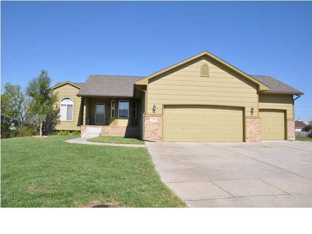 Front view of the Ranch home w/3 car garage