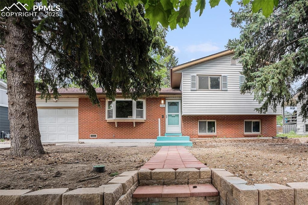 Beautiful Exterior Brick and Siding Finish among Majestic Pine Trees!