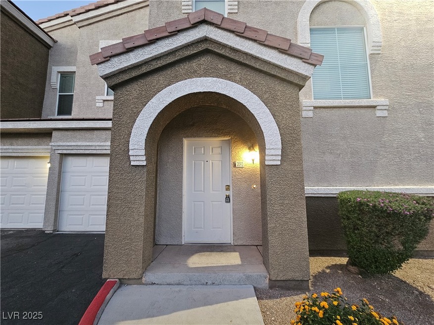 Entrance to property featuring stucco siding and a