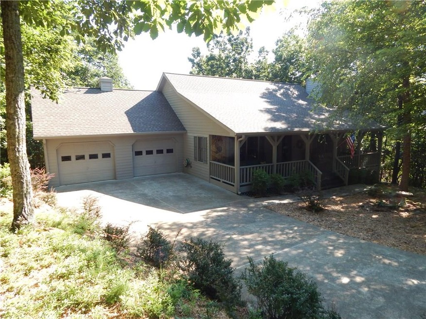 The front elevation shows the very private setting