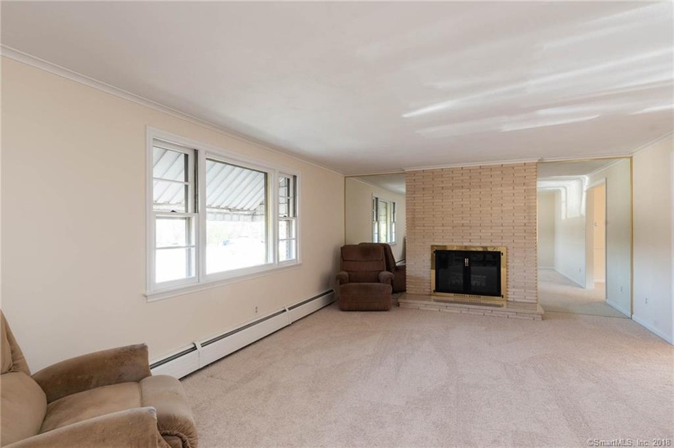 Generous sized formal living room with large bay window to allow natural light to flow in.