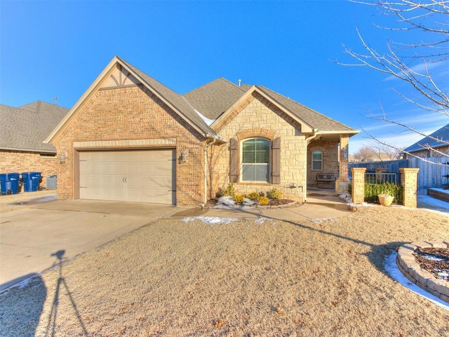 View of front facade with driveway, a front yard, 