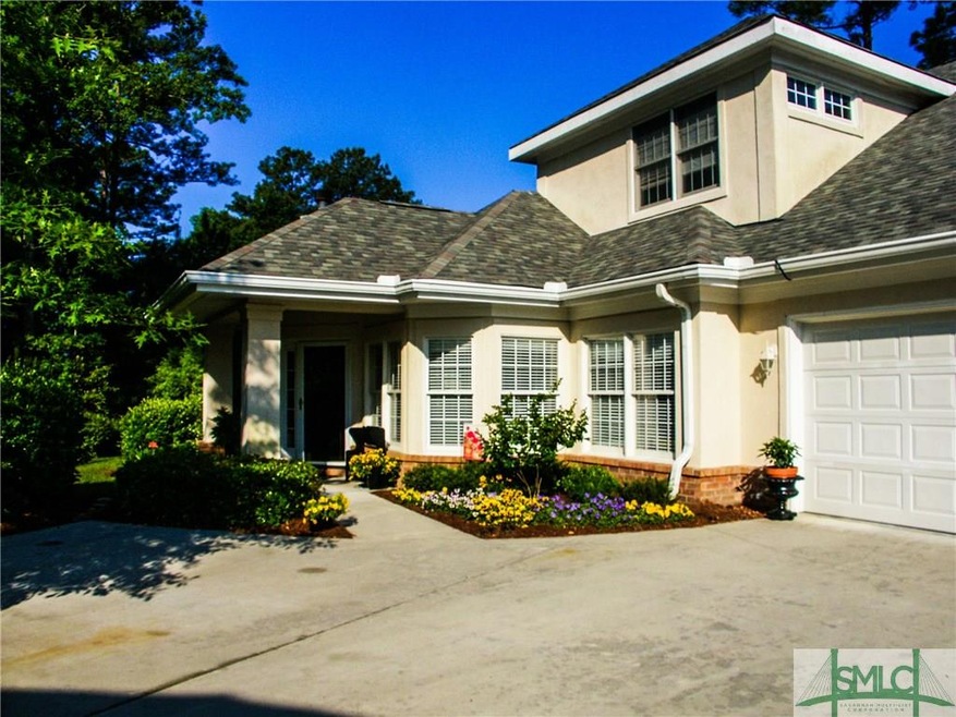 Two car garage is oversized and additional parking