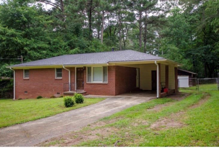 Four sided brick with carport