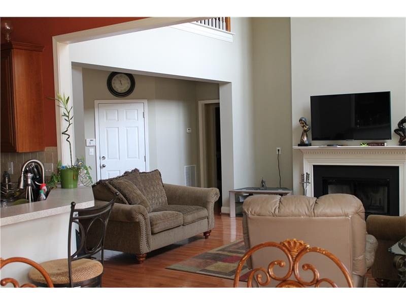 Spacious 2-story family room with pristine hardwoo