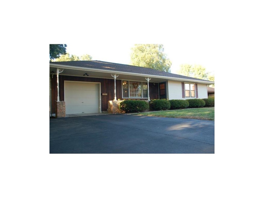 The front of the home features California Redwood,
