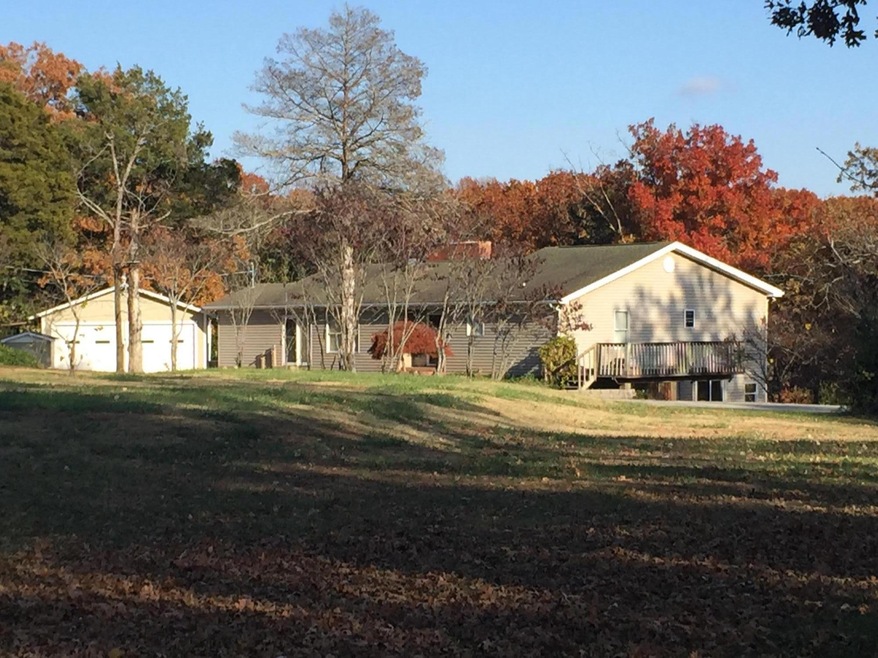 front exterior on 4 acres lakefront
