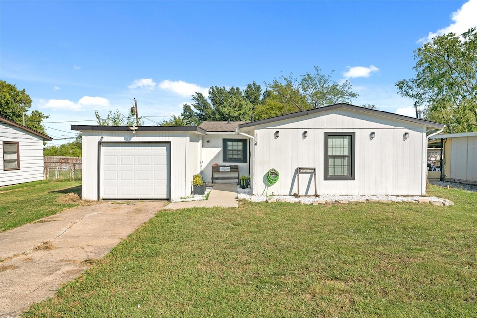 View of front of home featuring a garage and a fro