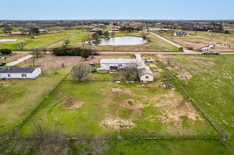 Bird's eye view with a water view and a rural view