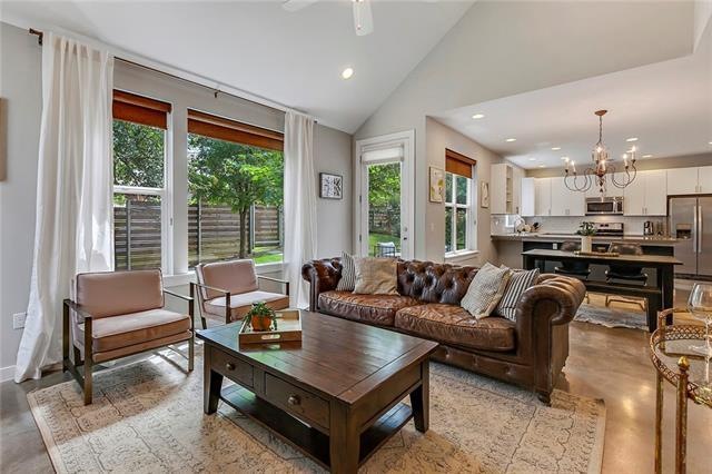 Living room with an expansive picture window and d