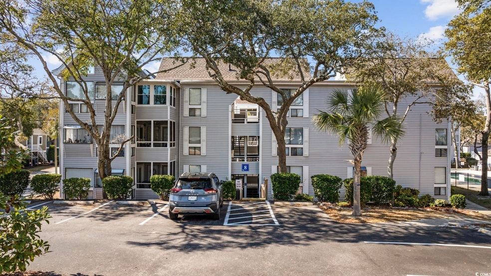 View of building exterior featuring uncovered park