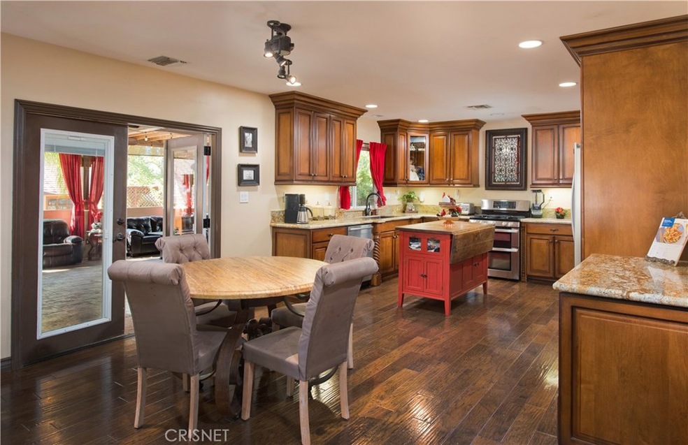 Remodeled kitchen with granite counters. Access to patio area.