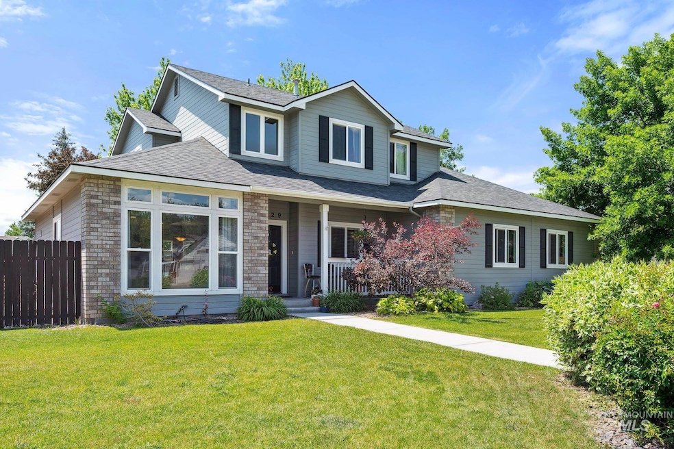 Traditional-style home featuring a porch and a shingled roof