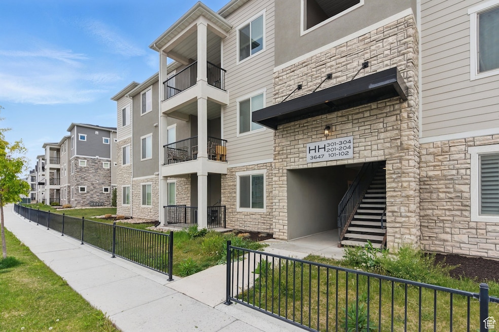 View of property with a fenced front yard and a residential view