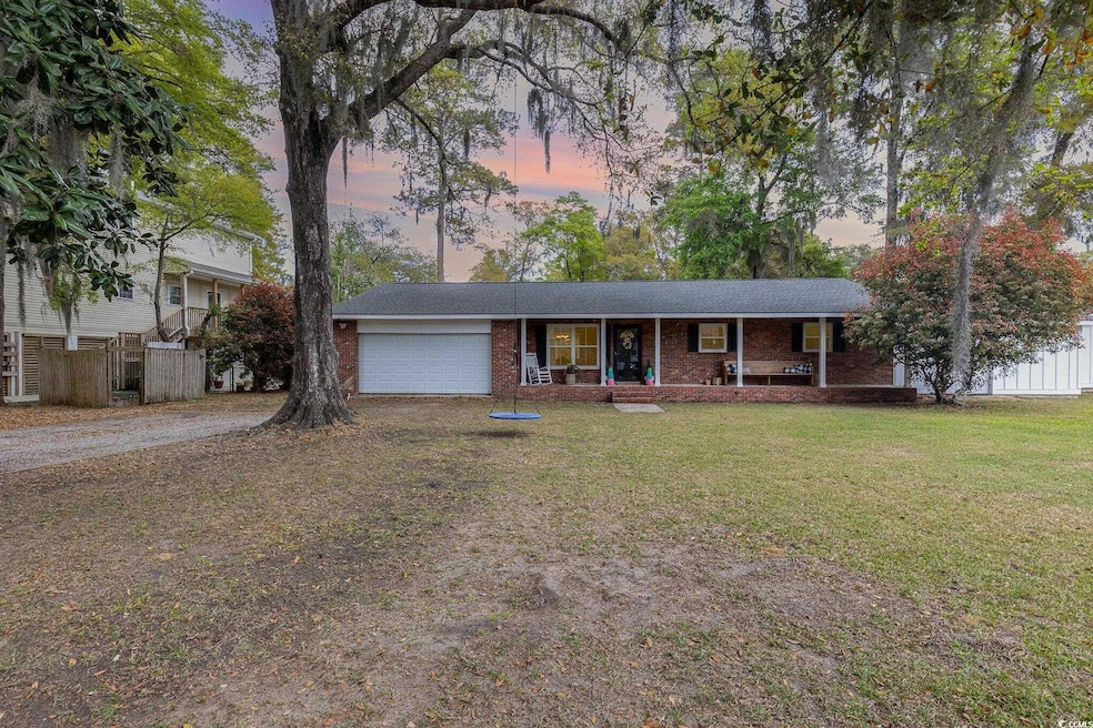Ranch-style home featuring a front yard, fence, br