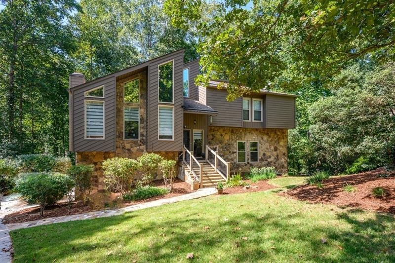 One of a kind home with multiple light-filled livi