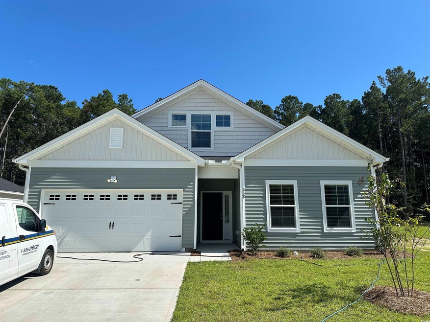 View of front of house featuring a garage and a fr