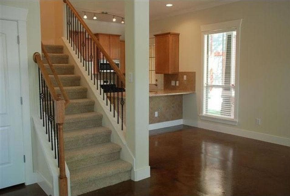 Staircase with recessed lighting and baseboards