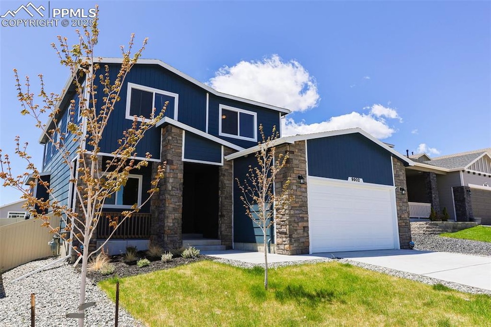Mid-century inspired home featuring stone siding, 