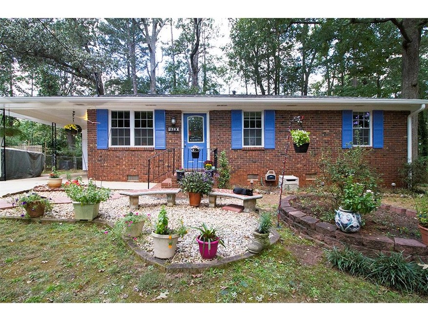 This beautifully updated cottage has a brick front