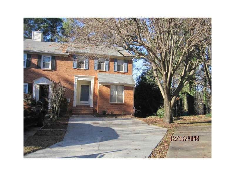 Exterior Front. end unit showing driveway parking