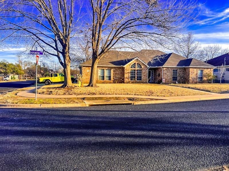 View of front of home featuring brick siding and 