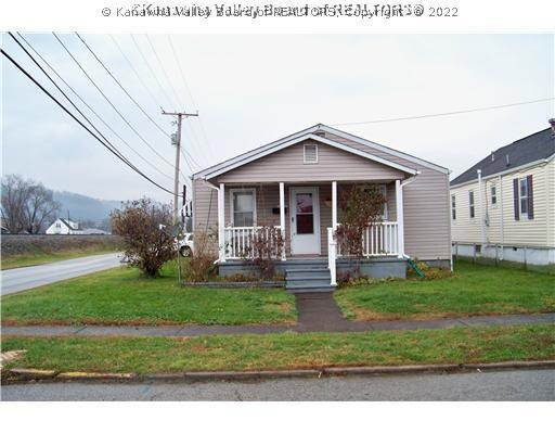 Exterior Front. Well kept home on large corner lot