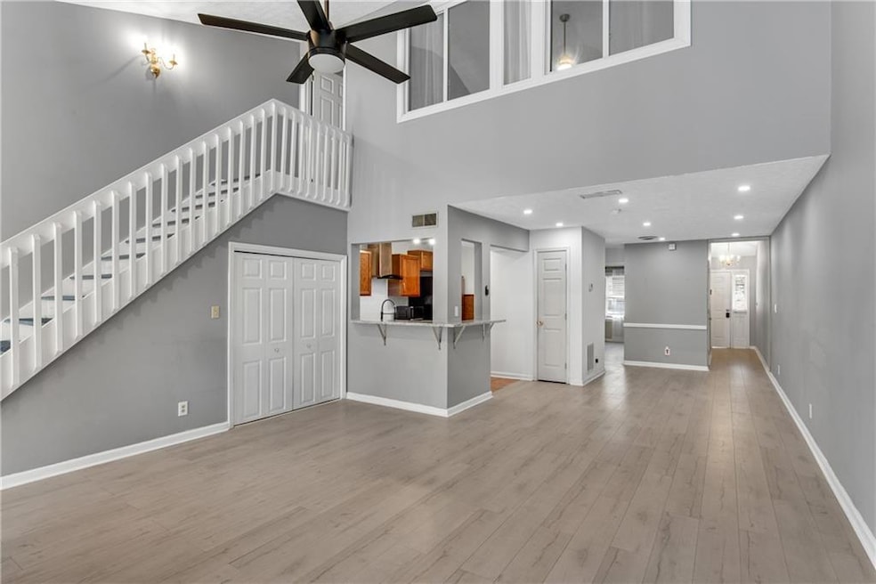 Spacious main living area with soaring ceilings.