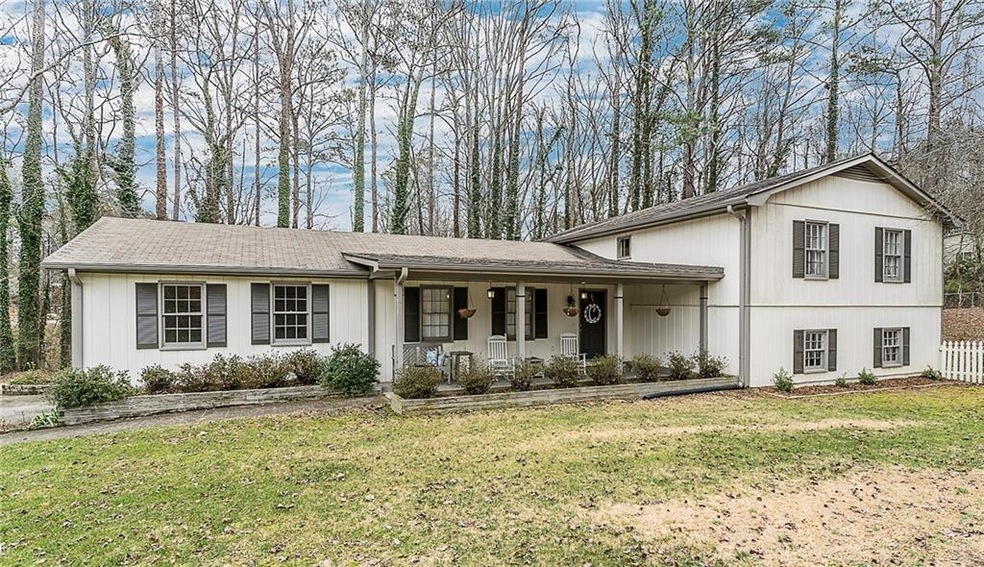 Beautiful home in Roswell.  Covered front porch, L