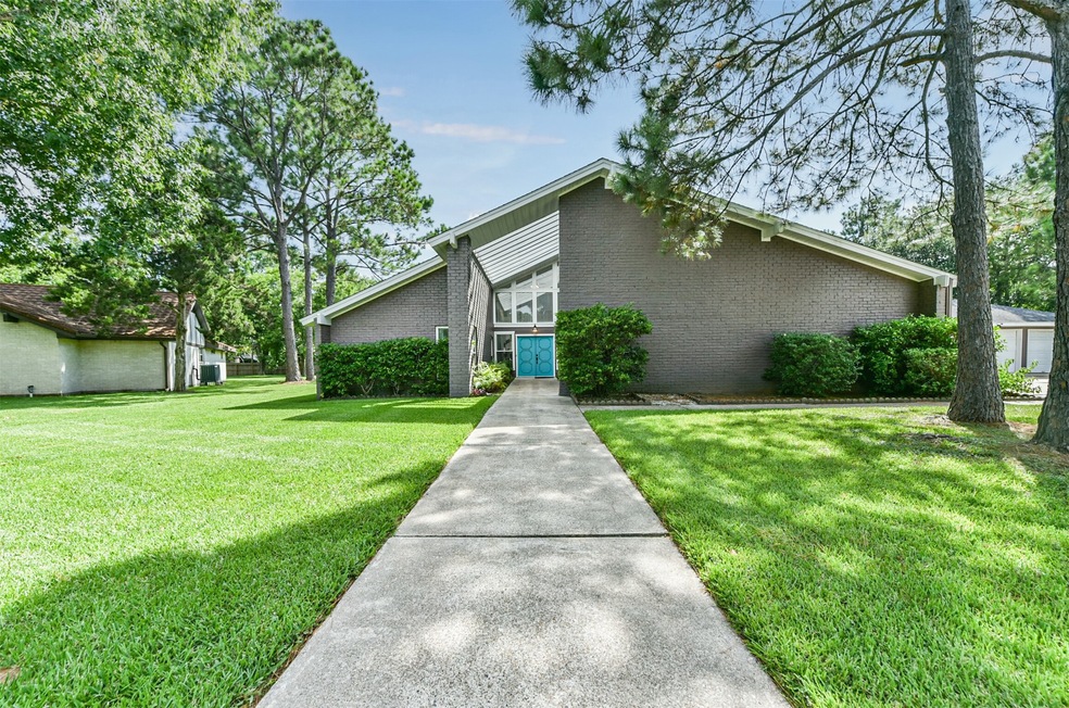 Welcome to 1012 Lynn Circle! This uniquely designed 1.5 story home with a 3 car garage and additional parking pad sits on a sprawling 0.69 acre shaded lot on a quiet cul-de-sac street in the heart of Friendswood.