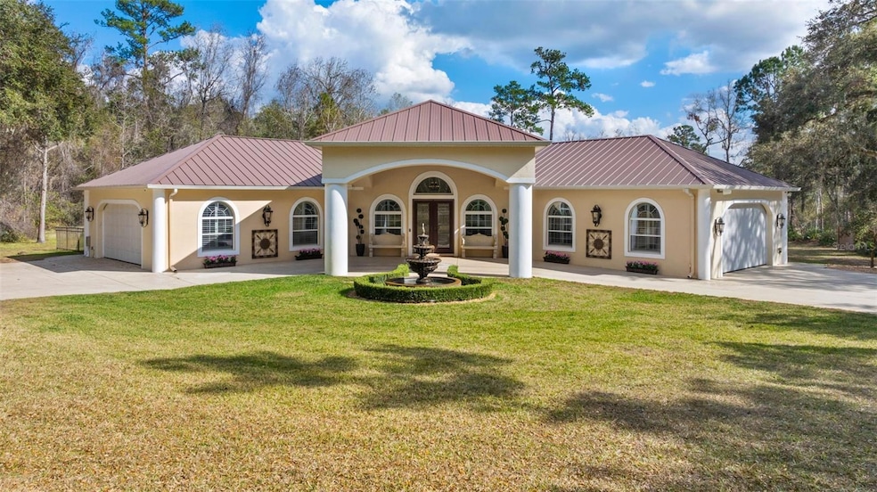 Welcoming portico entrance with serene fountain