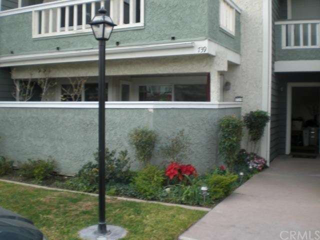 Front view of home. Entrance door is to the right.