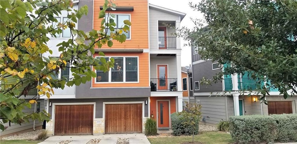 View of front facade with driveway and a garage