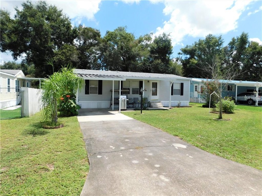 Front of home fenced on two sides.