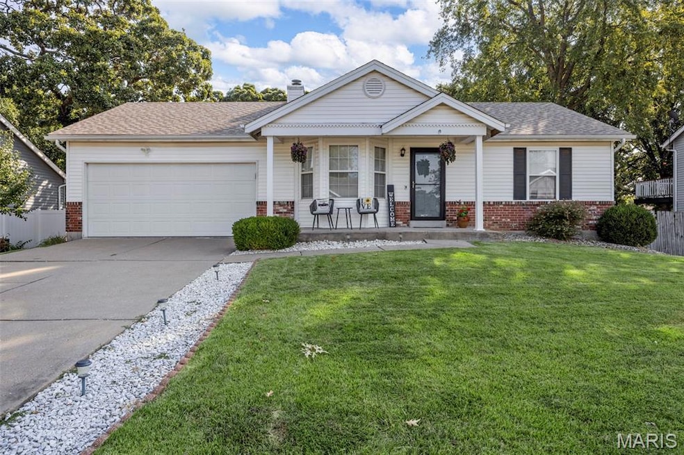 Front elevation with brick and vinyl siding