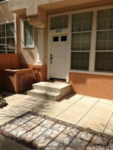 Oversized gated front patio entrance.