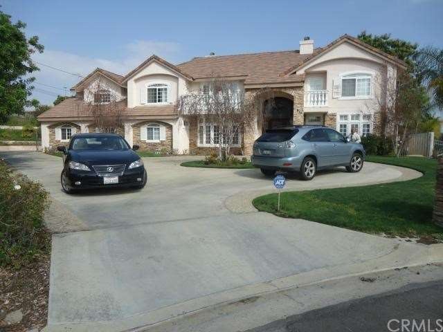 Beautiful Circular drive way leads you to garage i