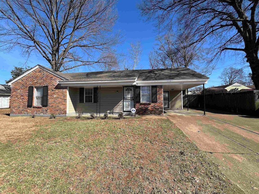 Single story home with brick siding, fence, an att