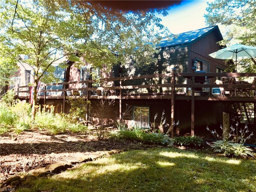 Exterior, wood sided, gambreled roof gables